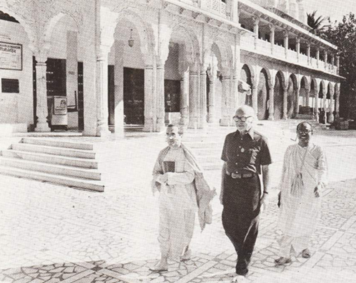 Dr. Puri, Dr. George Wald and Dr. T.D. Singh walking outside the Bhaktivedanta Institute